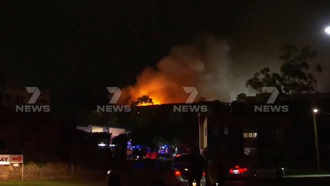 Firefighters spent hours battling a blaze which broke out in a Molendinar industrial complex on Monday night. Picture: 7 News