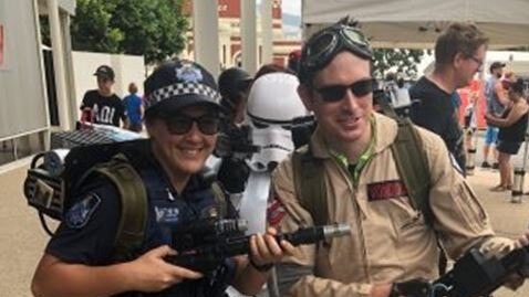 Constable Cameron Von Doom suits up as a Ghostbuster with Constable CJ Symonds donning an unlicensed nuclear accelerator at the CapriCon Pop Culture Convention in Rockhampton.