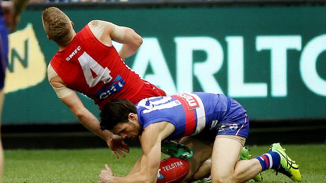 Sydney's Dan Hannebery was hurt in this tackle by Easton Wood. Picture: Colleen Petch