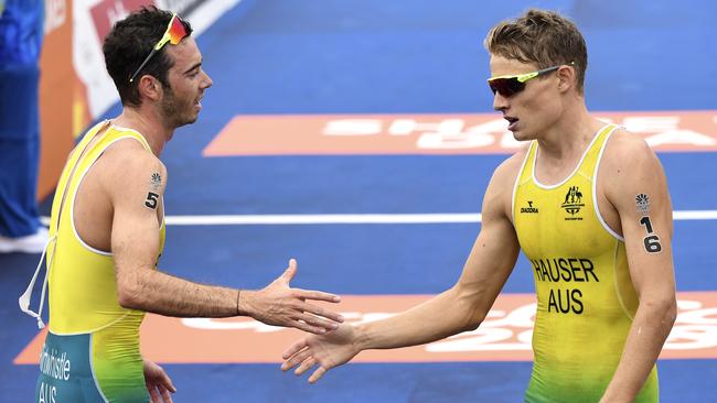 Jacob Birtwhistle, left, and team mate Matthew Hauser after the triathlon. Picture: AAP