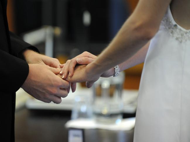 WEDDING DAY: Cameron and Andrea Von Doom at the Bundaberg Courthouse.Photo: Mike Knott / NewsMail