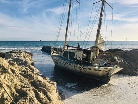 Attempts by the owner to get this stranded yacht off the beach atNorth Haven have failed. Picture: Supplied