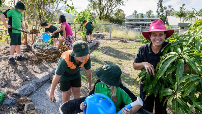 News The Australian, 3.5.2018 Yarwun QLD, Joint principal Amanda Ryan happy to be in the garden at Yarwun State School with Ben Dunphy and Abi Hartley in the wheelbarrow. Photo Paul Beutel