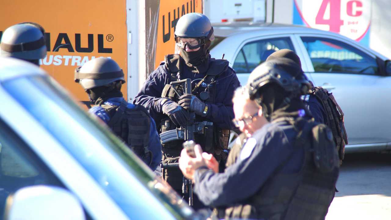 Heavily armed tactical police were involved in this morning's police operation at Sapphire Beach. Picture: Frank Redward