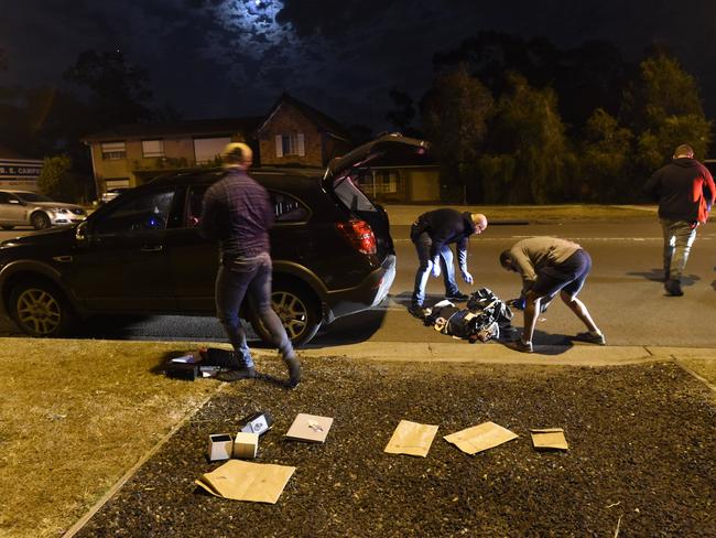 Plain clothed police searched the car. Picture: Gordon McComiskie