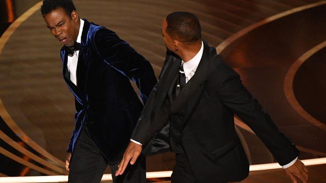 Will Smith (R) slaps US actor Chris Rock onstage during the 94th Oscars at the Dolby Theatre in Hollywood, California. (Photo by Robyn Beck / AFP)