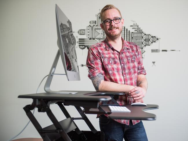 Office worker Mark Woodward, 35, at a height-­adjustable desk. Picture: Jason Edwards