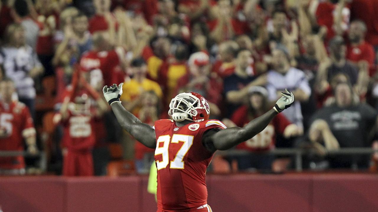 Kansas City Chiefs defensive end Allen Bailey celebrates after teammate Sean Smith intercepted a pass and ran it back 34-yards during the third quarter of an NFL football game against the New England Patriots, Monday, Sept. 29, 2014, in Kansas City, Mo. (AP Photo/Ed Zurga)