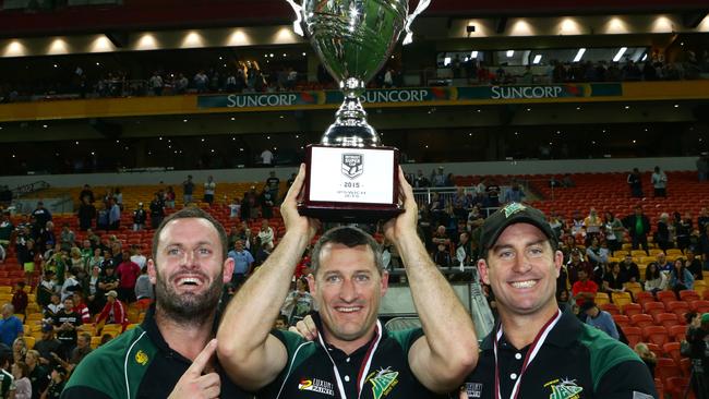 Chris Walker (left) and his brothers, Jets coaches Ben and Shane Walker (far right), celebrate winning the Intrust Super Cup grand final. It was Ipswich’s first ever title.