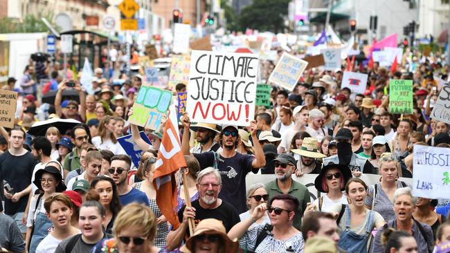 School students take part in a climate change strike in Brisbane, Friday, March 16, 2019. The strike is part of a global campaign to call for urgent action on climate change. (AAP Image/Dan Peled) NO ARCHIVING