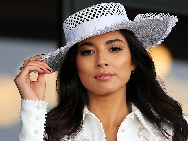 Jess Gomes holds onto her hat the Caulfield Cup. Picture: Mark Stewart