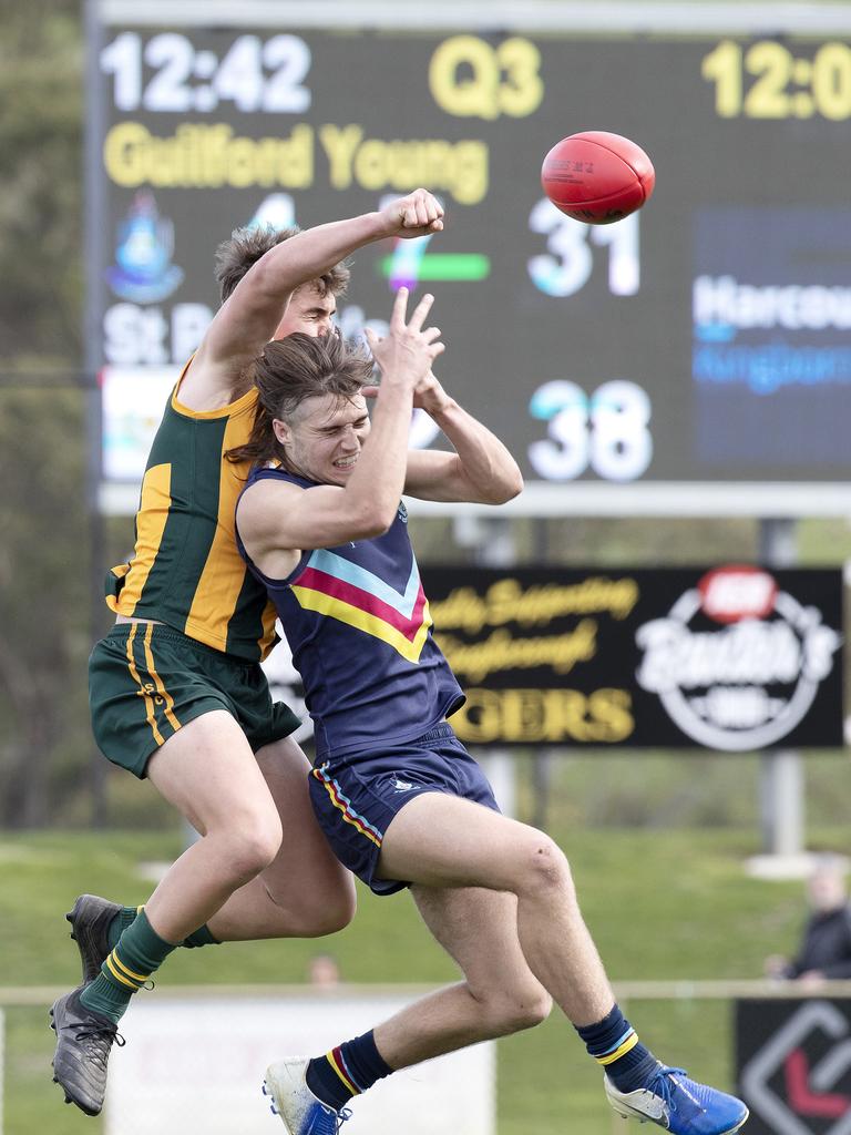 St Patrick’s College’s Khai Lunson spolis the mark of Guilford Young College’s Oliver Davis. Picture: Chris Kidd