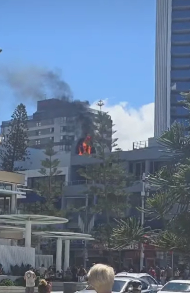 The fire has attracted a crowd of onlookers. Picture: Supplied