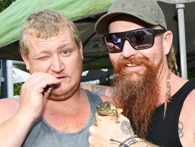 Colin Ballard and Bert Kellett with frog Menace Hopper, which won them a stack of cash at the Noonamah Tavern’s frog races. Picture: Katrina Bridgeford