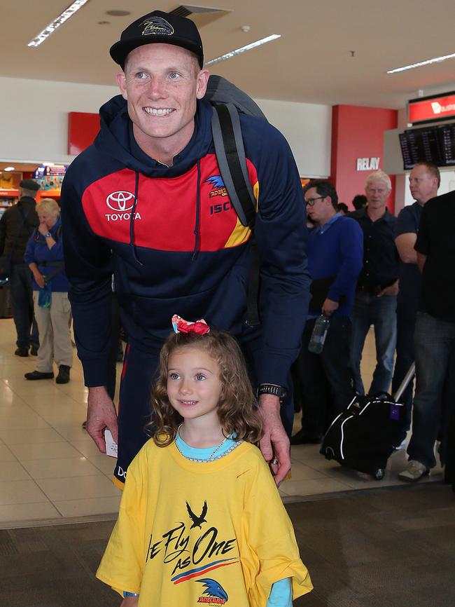 Crows ruckman Sam Jacobs towers over young fan Tessa Ferguson. Picture: Dylan Coker