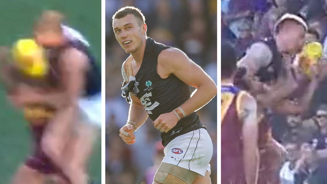 Patrick Cripps elected to make contact mid-air with Lion Callum Ah Chee.