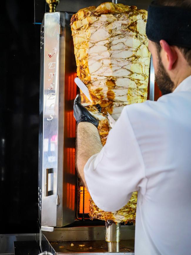 Chicken being sliced up on the rotisserie. Picture: Jenifer Jagielski