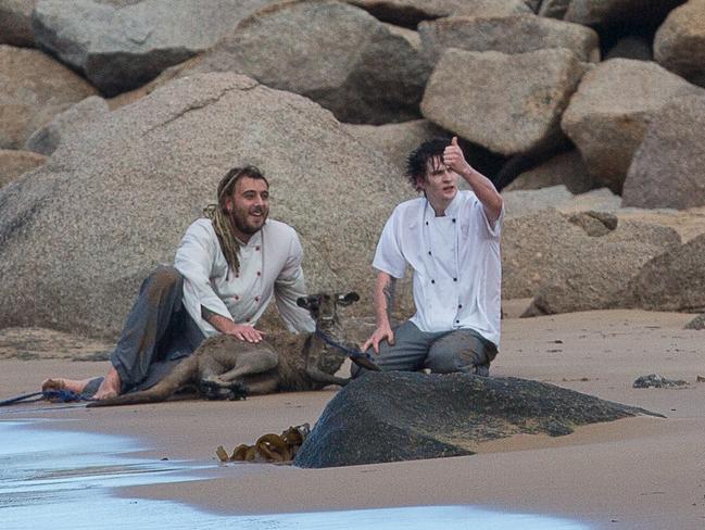 Jeff Della-Mina and Dan Marshall signal all is well after their herculean rescue of the kanagaroo. Picture: Stephen Muller