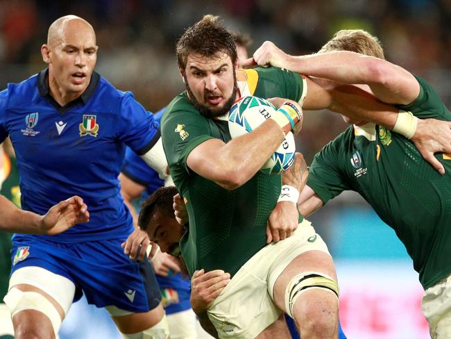 Lodewyk De Jager of South Africa on the charge against Italy.