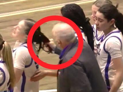 Coach Zullo continues berating Monroe after he yanked her hair. Photo: News10/NFHS Network.