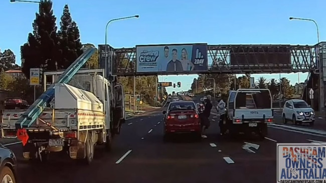 The two men appeared to be fighting on the road. Picture: Dashcam Owners Australia.