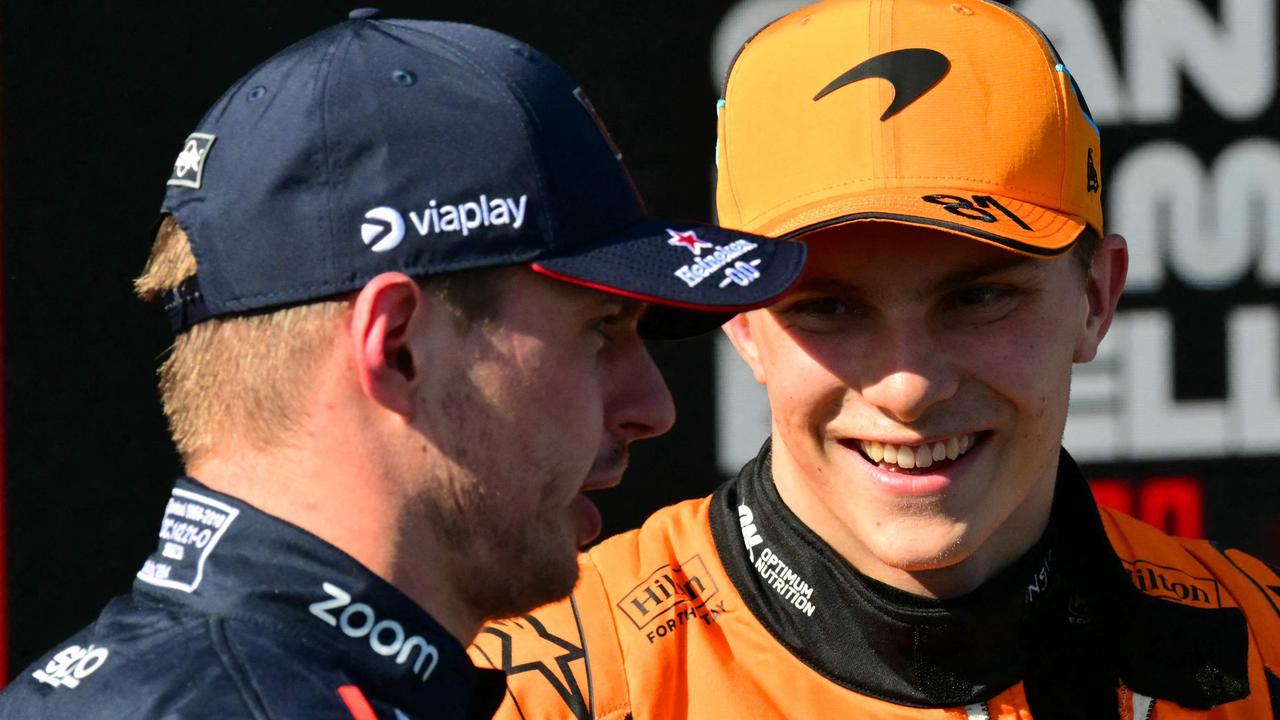 Pole position winner Red Bull Racing's Dutch driver Max Verstappen (L) speaks with second pole position winner McLaren's Australian driver Oscar Piastri in the qualifying session of Emilia Romagna Formula One Grand Prix at the Autodromo Enzo e Dino Ferrari race track in Imola on May 18, 2024. (Photo by ANDREJ ISAKOVIC / AFP)