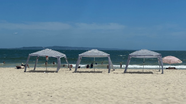 The beach cabanas have a very important job - and it's not about sun protection. Image: Kidspot 