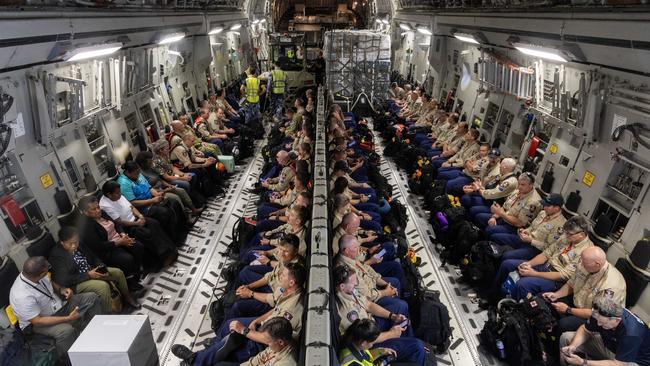 Disaster assistance response team personnel aboard a Royal Australian Air Force C-17A Globemaster III bound for Vanuatu from RAAF Base Amberley, Queensland, on Wednesday.