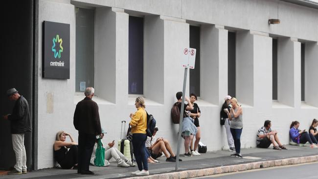 People queue up outside a Centrelink office as job cuts hit home. Pic: Peter Wallis