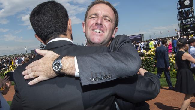 Charlie Appleby is congratulated by fellow Godophin trainer Saeed bin Suroor after Cross Counter’s win. Picture Jay Town