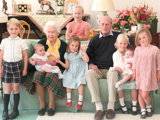 The Queen and Prince Philip with their great grandchildren Prince George of Cambridge, Prince Louis of Cambridge, rincess Charlotte of Cambridge, Savannah Phillips (standing at rear), Isla Phillips holding Lena Tindall, and Mia Tindall. Picture: AFP Photo/ Kensington Palace /Duchess of Cambridge