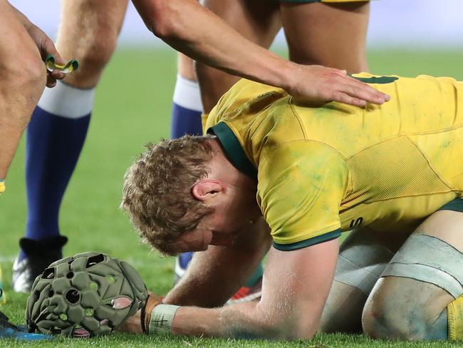 Jack Maddocks of Australia comforts David Pocock of Australia during the second Bledisloe Cup match between New Zealand and Australia at Eden Park in Auckland, New Zealand, Saturday, August 25, 2018. (AAP Image/Peter Meecham) NO ARCHIVING, EDITORIAL USE ONLY