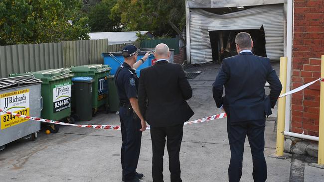 Police and detectives investigate the Magill fire scene on Thursday morning. Picture Mark Brake