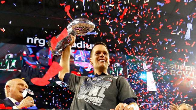 New England’s Tom Brady with the Vince Lombardi Trophy in Houston yesterday.