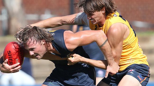 Luke Pedlar is tackled by Luke Nankervis. Picture Sarah Reed