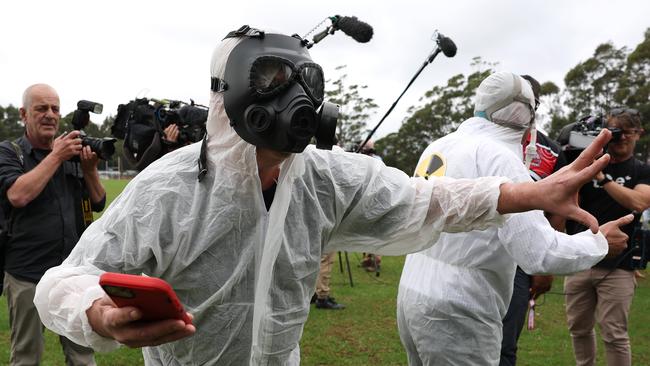 Peter Dutton was confronted by hazmat-wearing protesters. Picture: Adam Head / NewsWire