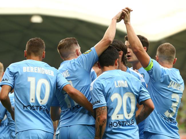 Players congratulate Noone after scoring against Newcastle Jets at AAMI Park.