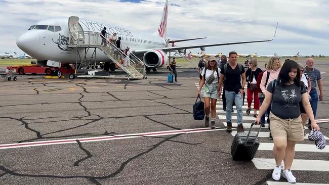 Alice Springs airport will receive fewer passengers when Qantas cuts routes next month.