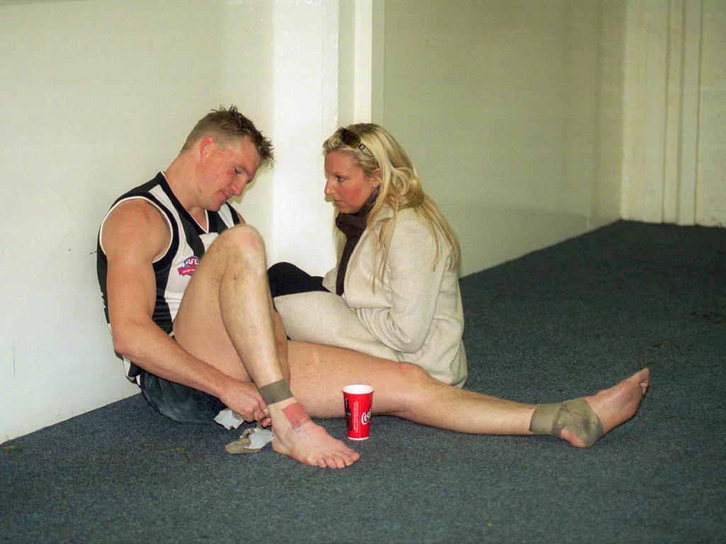 Nathan Buckley is consoled by girlfriend Tania Minnici after the 2002 Grand Final.