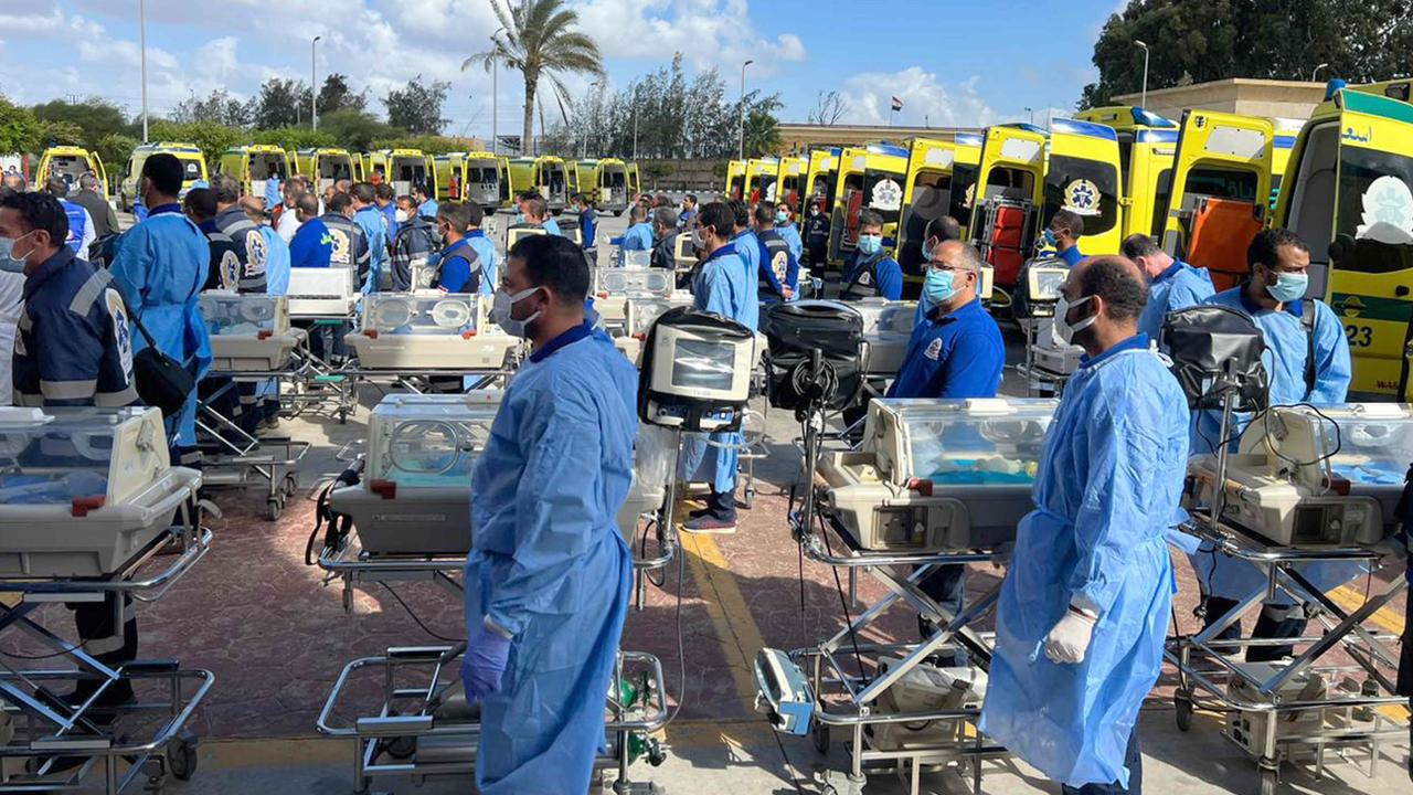 Egyptian medics stand by with incubators to receive twenty-nine premature Palestinian babies evacuated from Gaza on the Egyptian side of the Rafah border crossing. Picture: AFP