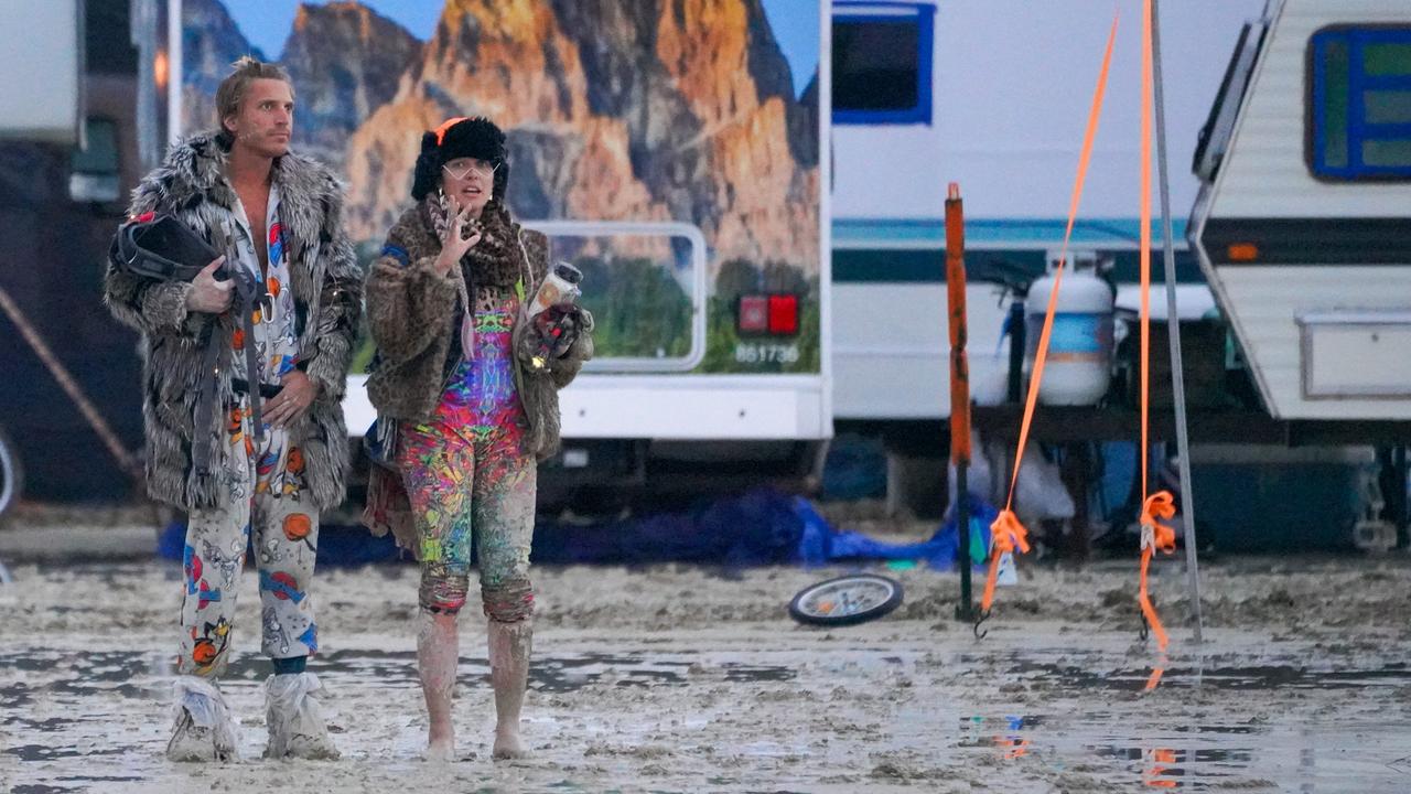 Burning Man festivalgoers trapped in Nevada desert as rain turns site