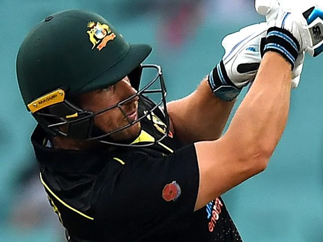 Australia's Aaron Finch plays a shot for six runs during the Twenty20 cricket match between Australia and Pakistan at the Sydney Cricket Ground in Sydney on November 3, 2019. (Photo by Saeed KHAN / AFP) / -- IMAGE RESTRICTED TO EDITORIAL USE - STRICTLY NO COMMERCIAL USE --