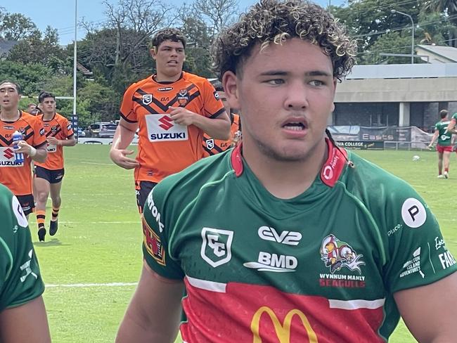 Wynnum-Manly player Majah-Jose Peachey, right, and a teammate, leave the field.