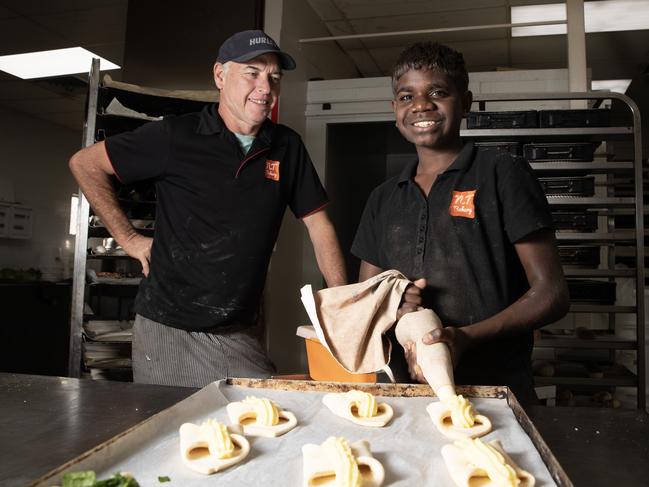 14-08-2024 - Scotty Goodwin, 14, who was abandoned by his mother at three months old, working at NT Bakery with baker and Alice Springs advocate Darren Clark. Picture: Liam Mendes / The Australian