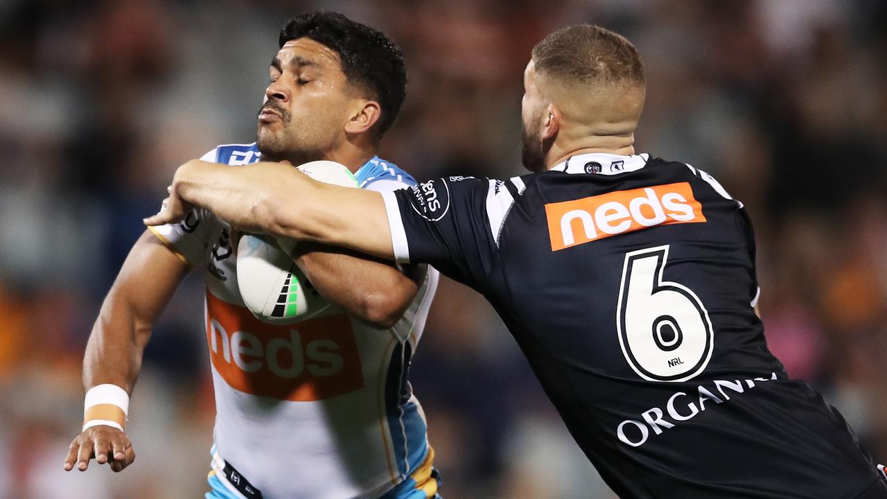 SYDNEY, AUSTRALIA - MAY 08: Tyrone Peachey of the Titans is tackled by Adam Doueihi of the Tigers during the round nine NRL match between the Wests Tigers and the Gold Coast Titans at Campbelltown Sports Stadium, on May 08, 2021, in Sydney, Australia. (Photo by Matt King/Getty Images)