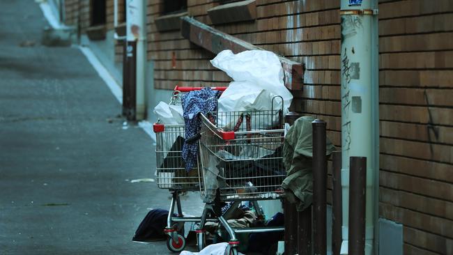 . A homeless person sleeps under a trolley in a Southport alleyway. Picture Glenn Hampson