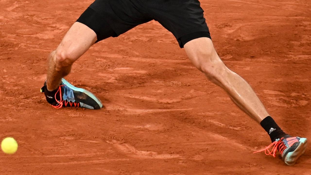 The feet of Germany's Alexander Zverev as he falls injured on court during his men's semi-final singles match against Spain's Rafael Nadal. (Photo by Tomas Stevens / AFP)