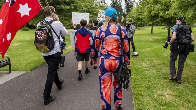 Former US President Donald Trump featured on a protester’s tracksuit. Picture: Jake Nowakowski