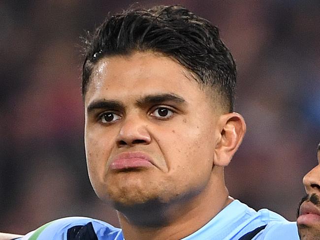 LtoR; Blues players Josh Morris, Latrell Mitchell, Josh Addo-Carr, Cody Walker and Damien Cook are seen during the Australian National Anthem prior to Game 1 of the 2019 State of Origin series between the NSW Blues and the Queensland Maroons at Suncorp Stadium in Brisbane, Wednesday, June 5, 2019. (AAP Image/Dave Hunt) NO ARCHIVING, EDITORIAL USE ONLY