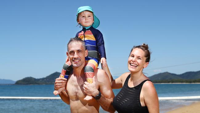 Cairns and Far North Queensland is experiencing an influx of interstate tourists arriving as the Easter school holidays begin around Australia. Ricardo, Mateo, 2, and Rebecca Sarnosky from Sydney enjoy a day of perfect warm sunny weather at Palm Cove beach for the start of their holiday. Picture: Brendan Radke